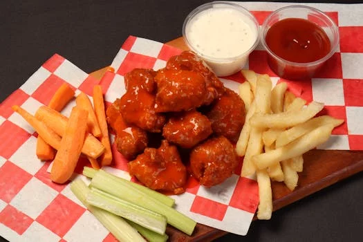 spicy buffalo wings with celery sticks